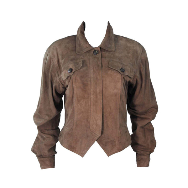 This Gucci jacket is composed of a supple khaki brown hue suede. Features center front button closures, and shoulder pads. In excellent vintage condition.