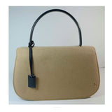 GUCCI Tan Wool Purse. This Gucci tan wool purse features a black bar closure, black leather handle, and attached leather tag. Measurements in Inches: Height: 7 Width: 11 Length: 3 Handle: 12