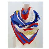 HERMES 1984 Summer Olympics Silk Scarf. Made in France of pure silk and finished by hand with finely rolled hand-stitched edges, this eye-catching Hermès scarf is 36" x 36" in size and features a 1984 Summer Olympics ABC torch and rings design.