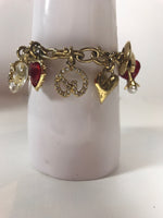 ST. JOHN Gold Toned Charm Toggle Bracelet with Hearts and Red Rhinestones