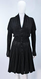 ALAÏA Vintage Black Fuzzy Stretch Dress Size XS. This Alaia dress is composed of a black fuzzy stretch fabric (rayon/viscose blend). Features batwing style sleeves and center front buttons. In excellent vintage condition. **Please cross-reference measurements for personal accuracy. Measures (Approximately) Length: 44.5" Bust: 38"-44" Waist: 22"-25" Hip: 38"