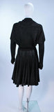 ALAÏA Vintage Black Fuzzy Stretch Dress Size XS. This Alaia dress is composed of a black fuzzy stretch fabric (rayon/viscose blend). Features batwing style sleeves and center front buttons. In excellent vintage condition. **Please cross-reference measurements for personal accuracy. Measures (Approximately) Length: 44.5" Bust: 38"-44" Waist: 22"-25" Hip: 38"