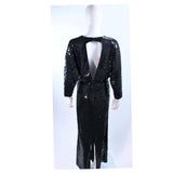 This Oleg Cassini is composed of a sequined black jersey. Features a draped front with center back zipper closure. In excellent vintage condition.