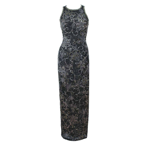 This Oleg Cassini gown is composed of a black silk with gold, black, and silver beading. Features a racer style neckline with center back zipper closure. In great vintage condition. 