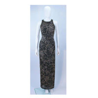 This Oleg Cassini gown is composed of a black silk with gold, black, and silver beading. Features a racer style neckline with center back zipper closure. In great vintage condition. 
