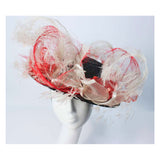 This Saks Fifth Ave. hat is composed of a black base with elastic piece for wear. Features white and red ostrich feathers. In excellent vintage condition. 