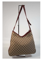GUCCI Canvas Logo Hobo Style Purse with Tassel