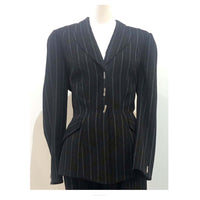 THIERRY MUGLER Black and White Stitched Pinstripe Pant Suit Size 40. This THIERRY MUGLER pant suit is composed of a wool pinstripe fabric. Features a classic Mugler silhouette with nipped waist and curved bust-line to neckline design. The jacket has front snap closures, rounded shoulders, and silver bar buttons. The classic pants features a zipper closure. In good vintage pre-owned condition. Made in France.Measurements in Inches:JacketBust: 40Waist: 32 PantsWaist: 27Hip: 40Length: 40Inseam: 29.5