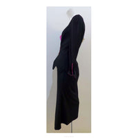 THIERRY MUGLER Black with Pink Lining and Cuff Skirt Suit Size 40. This THIERRY MUGLER skirt suit is composed of a black wool fabric with bright pink lining and cuff. Features a classic Mugler silhouette with nipped waist and curved bust-line to neckline design. The jacket has front snap closures, rounded shoulders, and a scalloped hem. The skirt features a zipper closure, flounce shape, and midi-length. In good vintage pre-owned condition. Made in France.Measurements in Inches:JacketBust: 40 Waist: 29 Skir