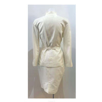 THIERRY MUGLER White Textured Cotton Skirt Suit Size 42. This Thierry Mugler skirt suit is composed of a white textured cotton fabric. Features a classic Mugler silhouette with nipped waist and curved bust-line to neckline design. The jacket has front snap closures, rounded shoulders, and a gathered panel detail at the back. The classic pencil style skirt features a zipper closure. In good vintage pre-owned condition. Made in France.Measurements in Inches:JacketBust: 42 Waist: 30 SkirtWaist: 28Hip: 38Length