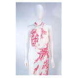 VALENTINO White with Red Coral Pattern Criss Cross Jersey Halter Dress Size 42. This Valentino gown is composed a white viscose with a red coral pattern. Features a lovely criss cross front with a body skimming design. In great pre-owned condition. **Please cross-reference measurements for personal accuracy. Size in description box is an estimation. Measures (Approximately)42Length: 54.5"Bust: 36"Waist: 32"-33"Hip: 34"-38"
